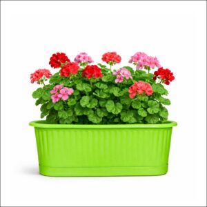 Bright green plastic railing planter with blooming flowers, ideal for balcony and garden decoration